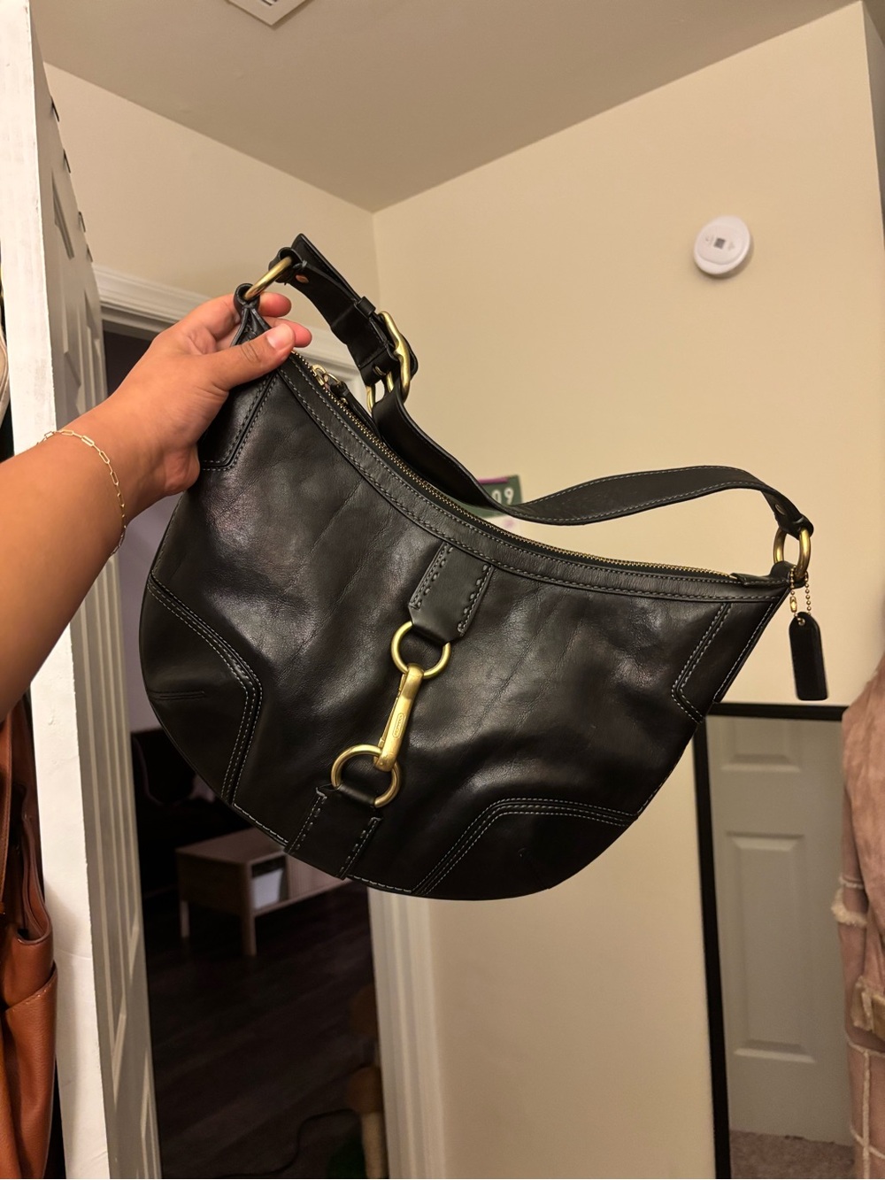 Coach Black Leather Shoulder Bag with Brass Hardware